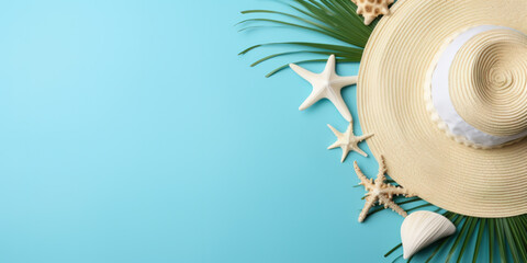 Summer straw hat, sea shells and palm leaves on blue background. Summer concept, with empty space for advertising or text