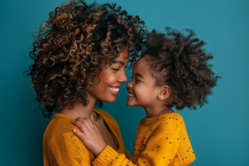 A mother and daughter are hugging each other in a yellow sweater - obrazy, fototapety, plakaty