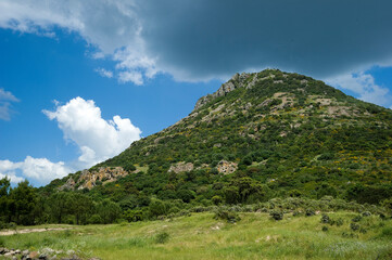 landscape with blue sky and clouds, Mount Minerva. Villanova Monteleone, Sassari, Sardinia, Italy.