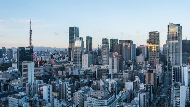 Timelapse view of sunrise over skyscrapers in the Minato district of Tokyo, Japan. 