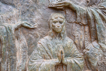 Fototapeta na wymiar The Coronation of Mary – Fifth Glorious Mystery of the Rosary. A relief sculpture on Mount Podbrdo (the Hill of Apparitions) in Medjugorje.