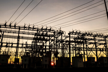 Silhouette of substation for the distribution of electric power with  in Brazil, with sundown background