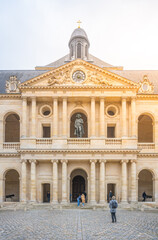 The statue of Napoleon Bonaparte stands prominently at the niche of Les Invalides. Paris, France