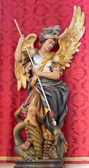 VICENZA, ITALY - NOVEMBER 5, 2023: The in the carved polychorme statue of St. Michael archangel in the church Chiesa di Santa Maria dei Servi by Albert Comploj da Ortisei from 20. cent.
