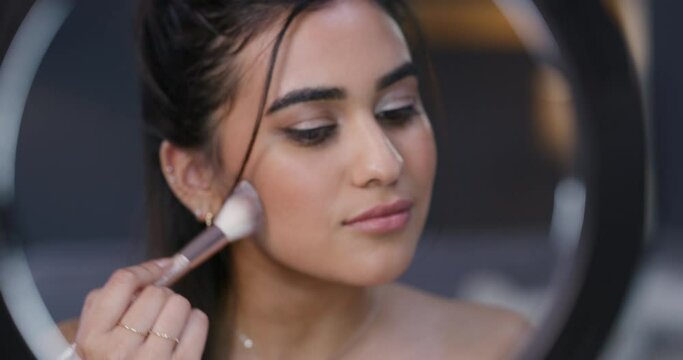 Makeup, beauty and woman in living room for streaming, video shoot or online tutorial for marketing at home. Cosmetics, social media and influencer vlog on phone with light in lounge of apartment.