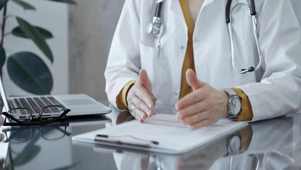 Doctor and patient discussing health concerns during a clinic visit. Medicine and health care
