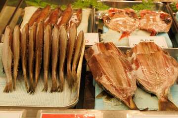 Dried fish sold in packs or individually in a market in Japan