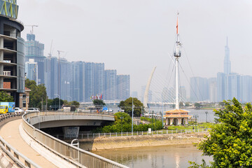 A bridge over the Saigon river in Ho Chi Minh City (Saigon), Vietnam, with the Thu Thiem 2 Bridge (Cầu Ba Son) and Landmark 81 in the background
