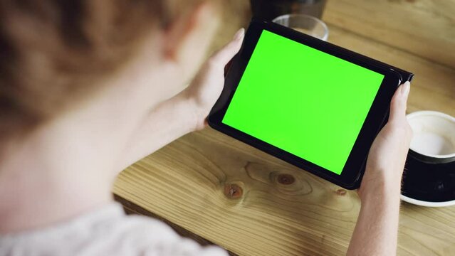 Tablet, green screen and hands of person with digital communication, media app or online blog story. Mockup space, UX or tech user with graphic design, social network or information on interactive UI