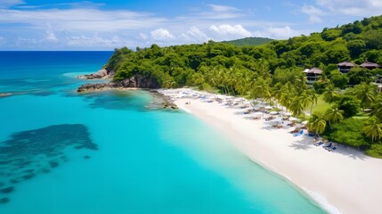 Aerial view of beautiful tropical beach with white sand, turquoise ocean water and blue sky