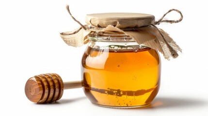 Glass jar full of honey and wooden stick on a white background. - obrazy, fototapety, plakaty