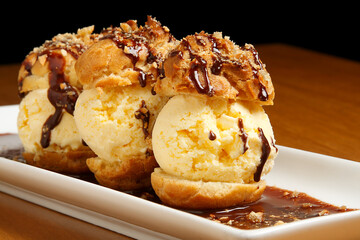 ice cream balls with cake and chocolate sauce