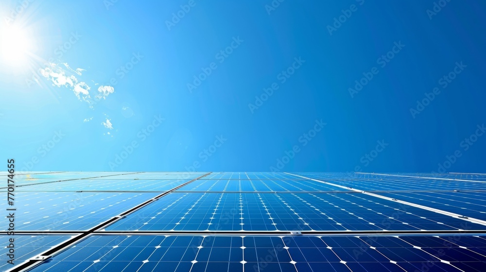 Poster a closer view of the solar panels arranged in a neat grid pattern and reflecting the bright blue sky