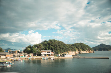 Fototapeta na wymiar 香川県高松市の沖合の島「男木島」の男木港の風景