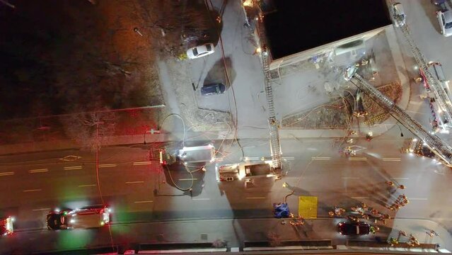 Firefighters At The Scene Of Fire Incident On Abandoned Building In Montréal, Québec, Canada - Aerial Top Down