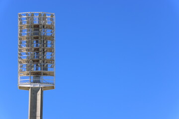 Light-emitting diode (LED) light tower, or floodlights, at large sports stadium or venue.  Clear...