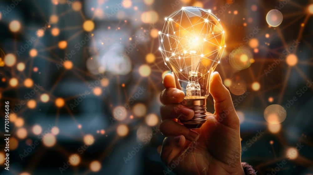 Poster hand holding a glowing lightbulb with network - a concept image of a hand holding a light bulb surro