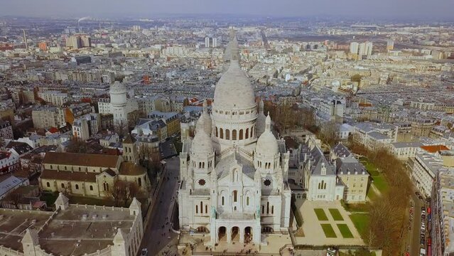 Basilica of the Sacred Heart of Paris and Montmartre aerial view with City Spread Out Beneath