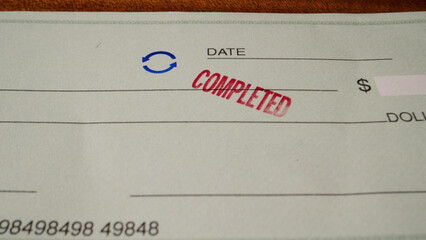 7 photo of blank green generic check on table with completed stamp