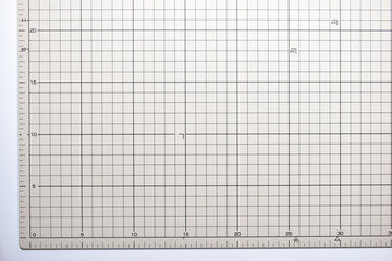 gray cutting mat board background with line and scale measure guide pattern for object art design, tool equipment of diy craft work