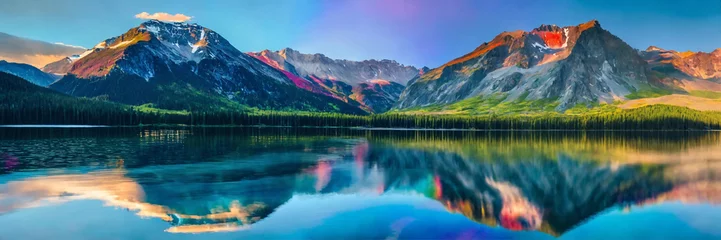 Foto auf Acrylglas Mountains towering over a serene lake © babarkhan