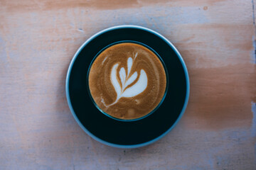 cup of coffee on wooden background