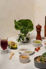 Family Vegetarian Feast with Fresh Vegetable Spread on the Dinner Table showcasing fresh vegetables, complemented by olive oil, wine, pepper, and assorted ingredients as lettuce, tomato, avocado