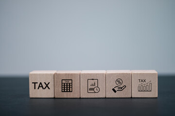 Tax concept. Government, state taxes. Data analysis, financial research, report. Calculation tax return. TAX icon on wooden block.