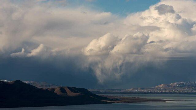 Timelapse of storm clouds moving over Lehi Utah looking over Utah Lake across the valley.