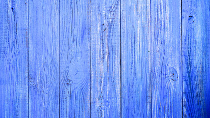 Fototapeta na wymiar The texture of the old wooden background is bright blue. Wooden surface with cracks.