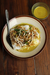 Chicken Porridge with yellow soup. 