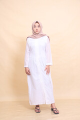young asian muslim woman standing flat expression. Fashion, pointer, business and promotion concept