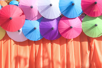 Umbrella colorful patterns decorative on fabric wall background
