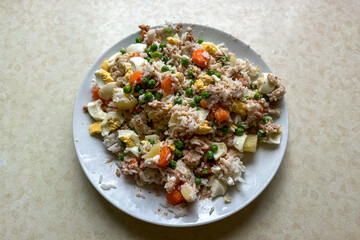 Homemade rice salad with vegetables and tuna
