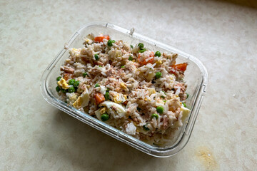 Homemade rice salad with vegetables and tuna
