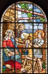 Foto op Canvas MILAN, ITALY - MARCH 6, 2024: The Holy Family in the stained glass of the church Chiesa del Redentore by unknown artist (1933). © Renáta Sedmáková