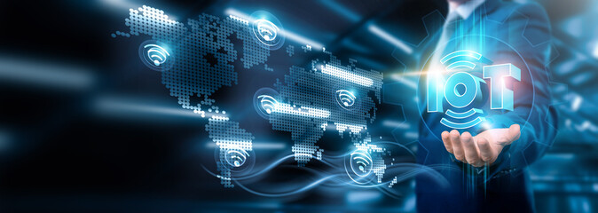 Businessman holding IoT connection on sensor-driven networking and device data integration, Business strategy and connectivity, automation, optimization, Technology and global transformation.