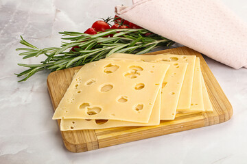 Sliced maasdam cheese with holes