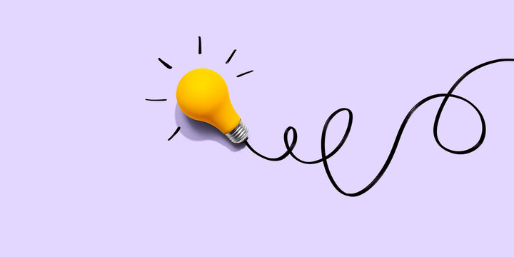 Brainstorming concept with a yellow light bulb - Flat lay