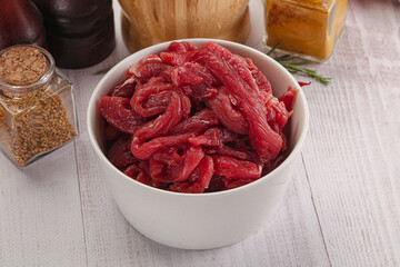 Raw beef meat - sliced strips