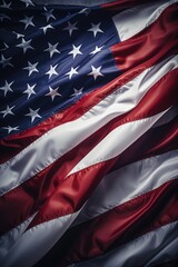A red, white and blue American flag is shown in a close up. The flag is waving in the wind, and the stars are visible on the top. Concept of patriotism and pride in one's country