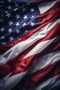 A red, white and blue American flag is shown in a close up. The flag is waving in the wind, and the stars are visible on the top. Concept of patriotism and pride in one's country