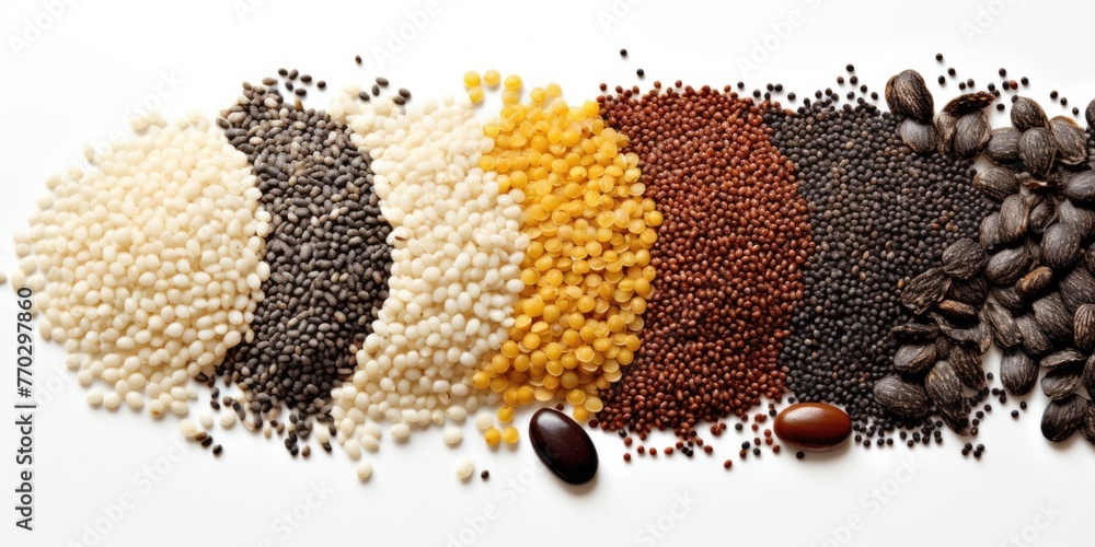Poster a variety of different colored and shaped seeds and nuts are spread out on a white background. conce