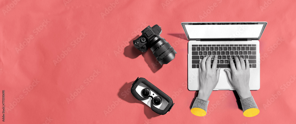 Poster laptop computer with a slr camera and vr from above