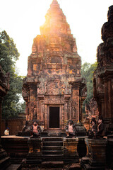 The sunset behind the beautiful pagoda in Banteay Srei Temple in Siem Reap, Cambodia