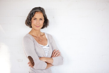 Mature woman, portrait and confidence in studio with background for positivity, smile and style....