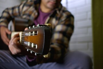 latino man with a guitar
