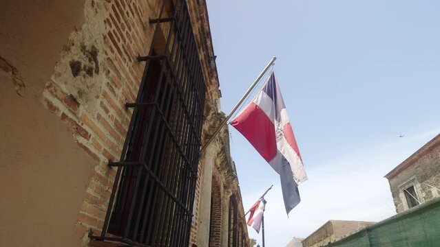 Flag of Dominican Republic on the side of the house with window bars