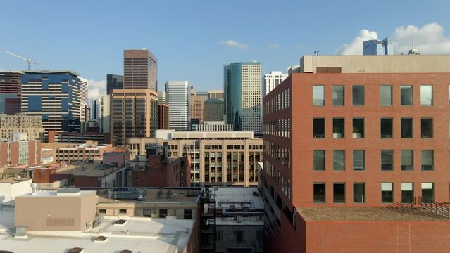The sun reflecting in the windows of buildings in the metropolitan area in Denver, Colorado.