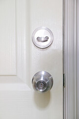White door with deadbolt lock and Doorknob